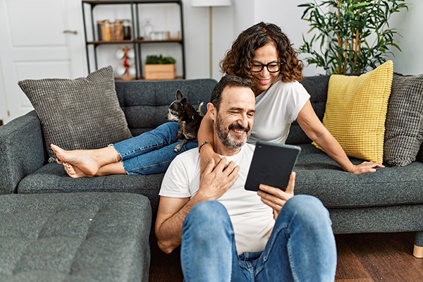 Woman smiling at laptop